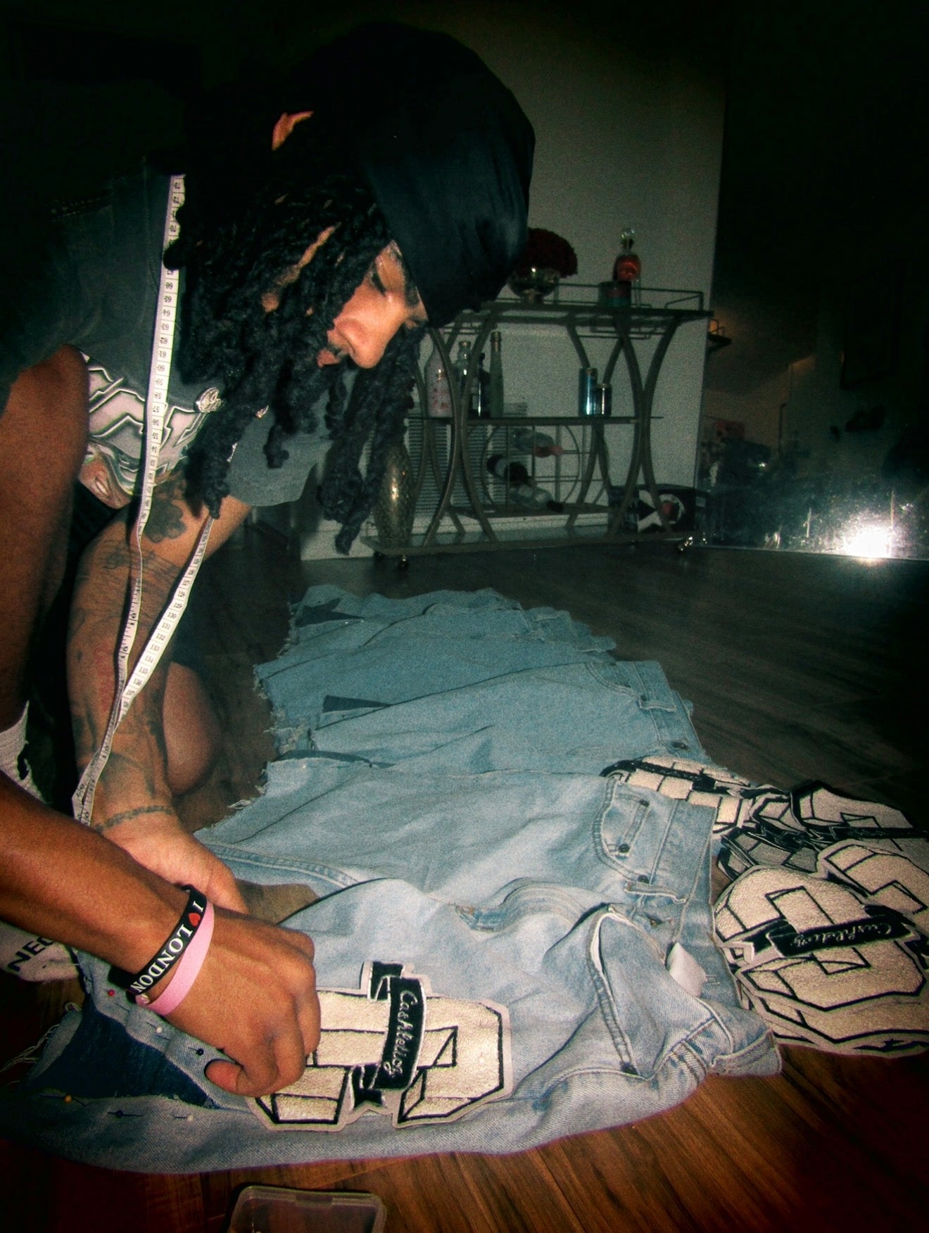 Cashleticz founder measuring and constructing garments in house